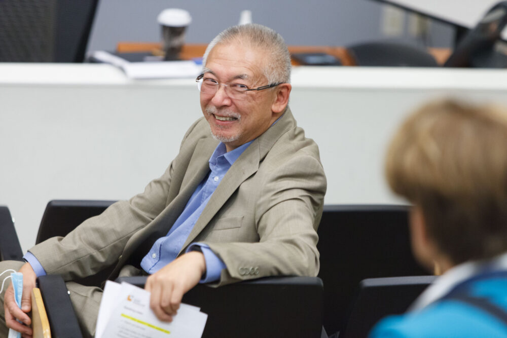 Sunny Loo, patient partner representative, sits in a lecture hall at Royal Jubilee Hospital, Victoria.