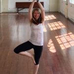 Sarah Greene doing yoga in New Orleans, indoors