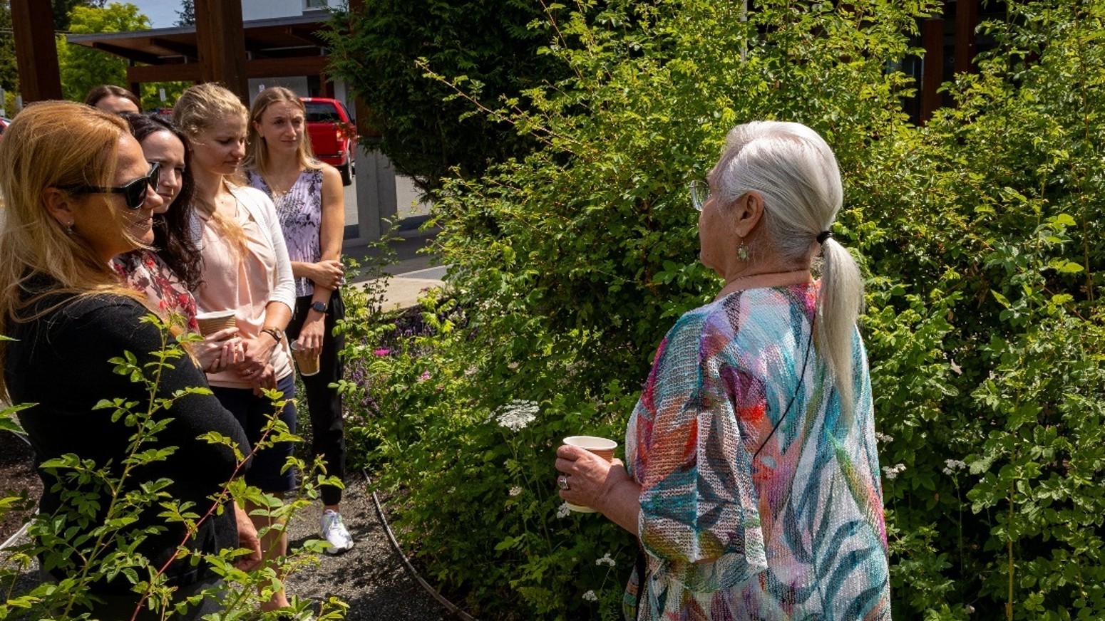 Elder Barb Whyte (right) leads the project team (left) through the Comox Valley Hospital Gardens. Photo: Island Health.