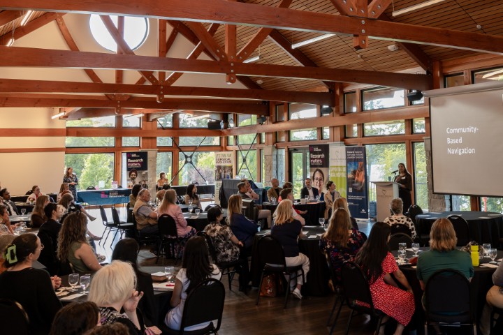 Image shows a room full of event participants at the Partnering in Health Innovation, an event held in Victoria in June