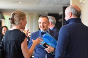 Geoff Payne speaking to two other attendees at the Made in the North event.